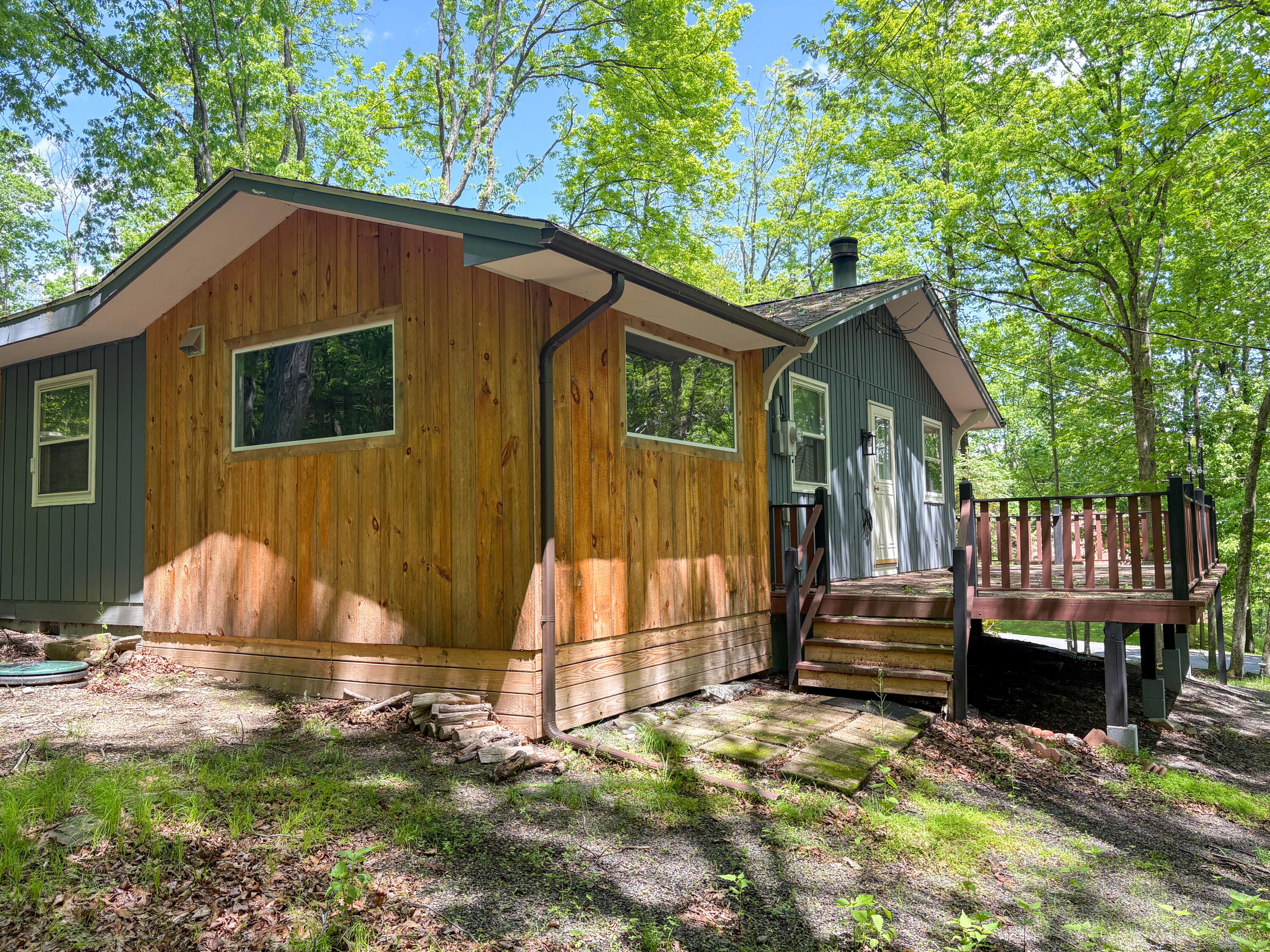 1085 Maple Lake Drive Bushkill, PA 18324 - Photo 25 of 35 a backyard of a house with table and chairs