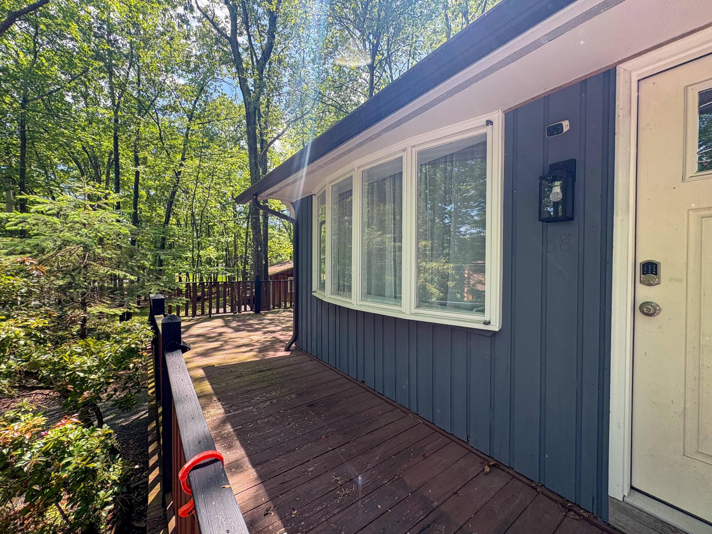 1085 Maple Lake Drive Bushkill, PA 18324 - Photo 31 of 35 a view of backyard with deck and outdoor seating