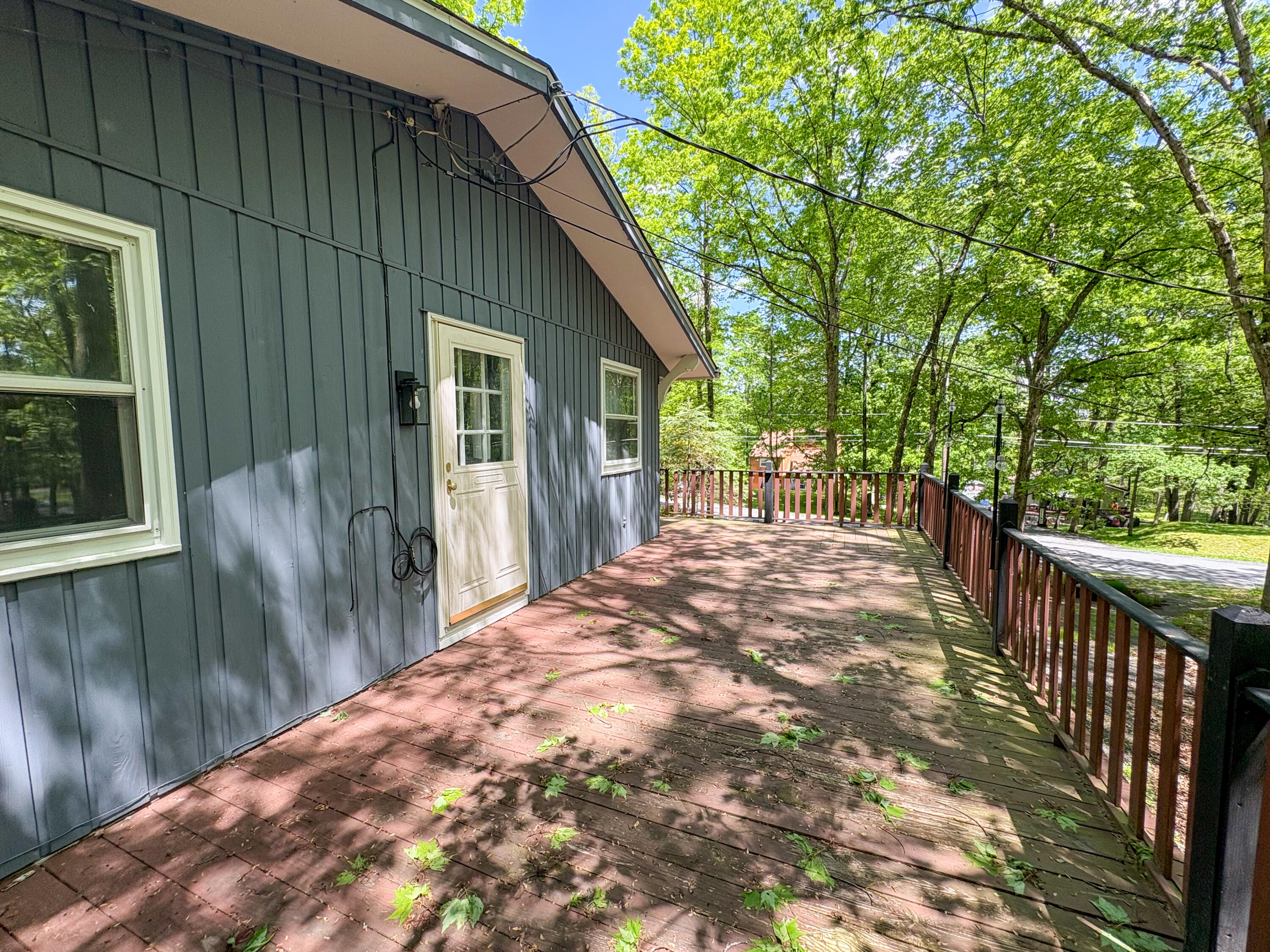 1085 Maple Lake Drive Bushkill, PA 18324 - Photo 33 of 35 a view of a house with backyard and deck