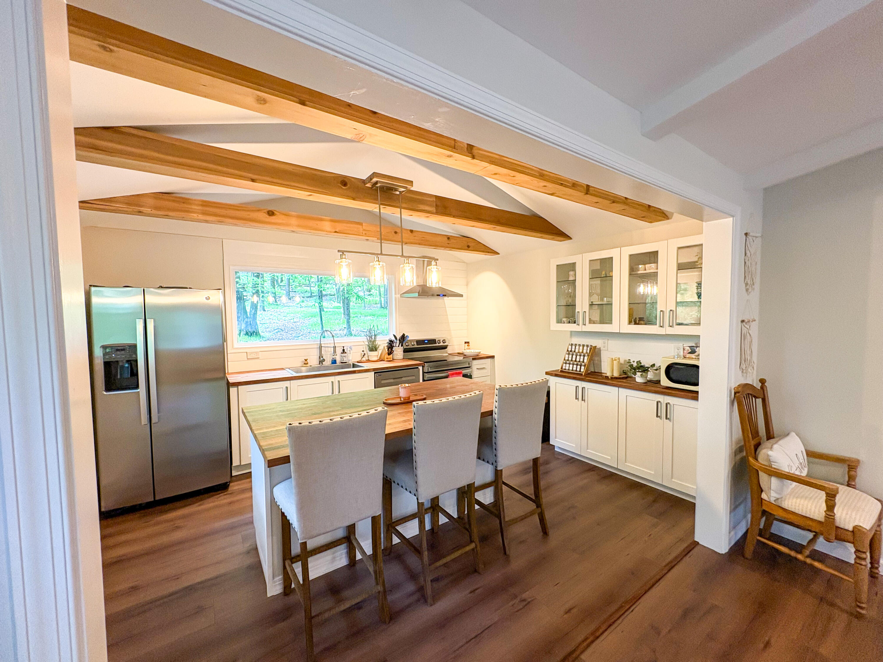1085 Maple Lake Drive Bushkill, PA 18324 - Photo 5 of 35 a kitchen with a table chairs and wooden floor