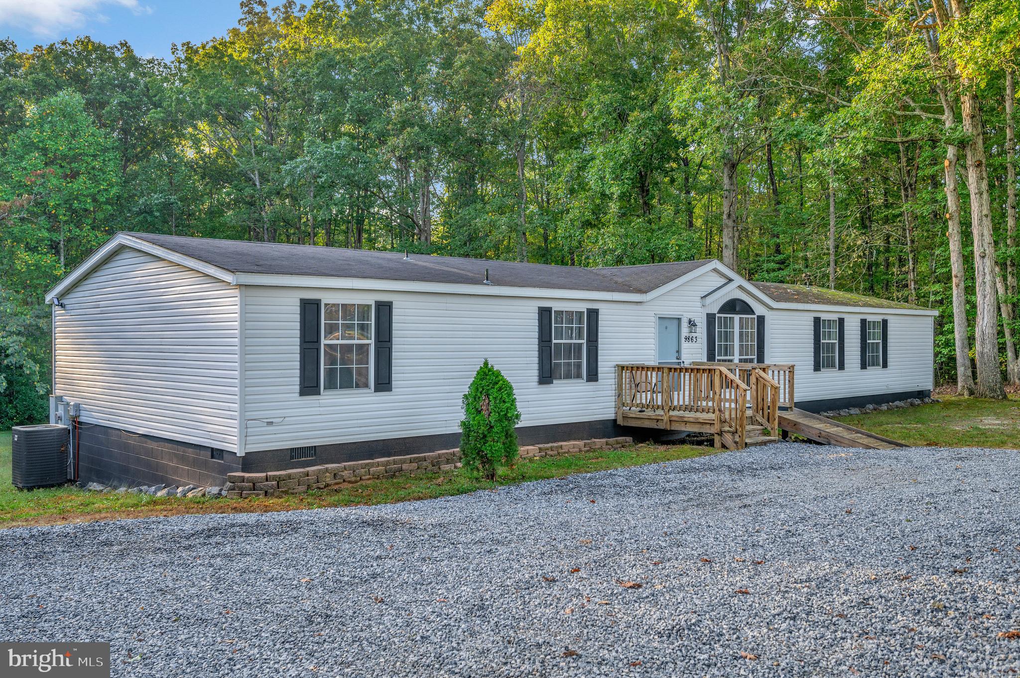 a view of house with outdoor space and sitting area