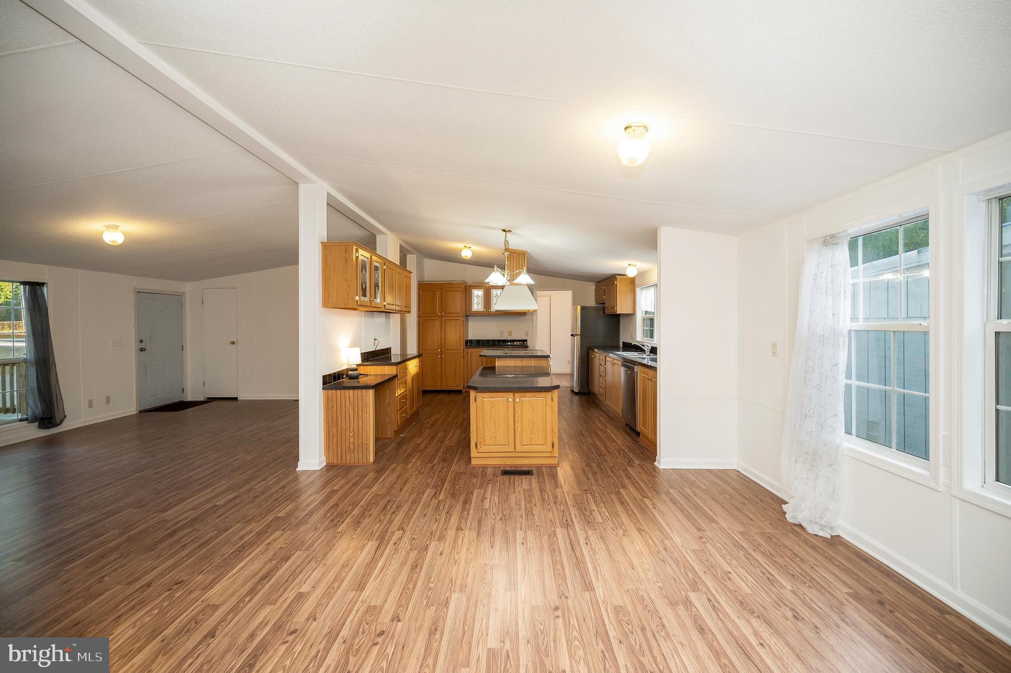 9863 Red Hill Road Spotsylvania, VA 22553 - Photo 16 of 53 a view of kitchen with stainless steel appliances refrigerator stove microwave and cabinets