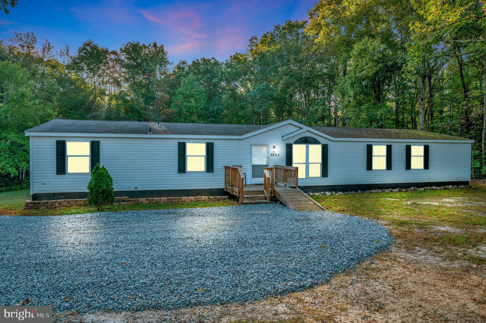 9863 Red Hill Road Spotsylvania, VA 22553 - Photo 2 of 53 a house that has a big yard with wooden fence