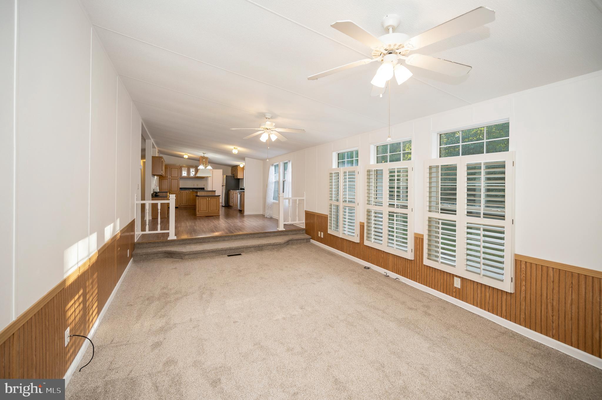 9863 Red Hill Road Spotsylvania, VA 22553 - Photo 28 of 53 an empty room with windows and ceiling fan