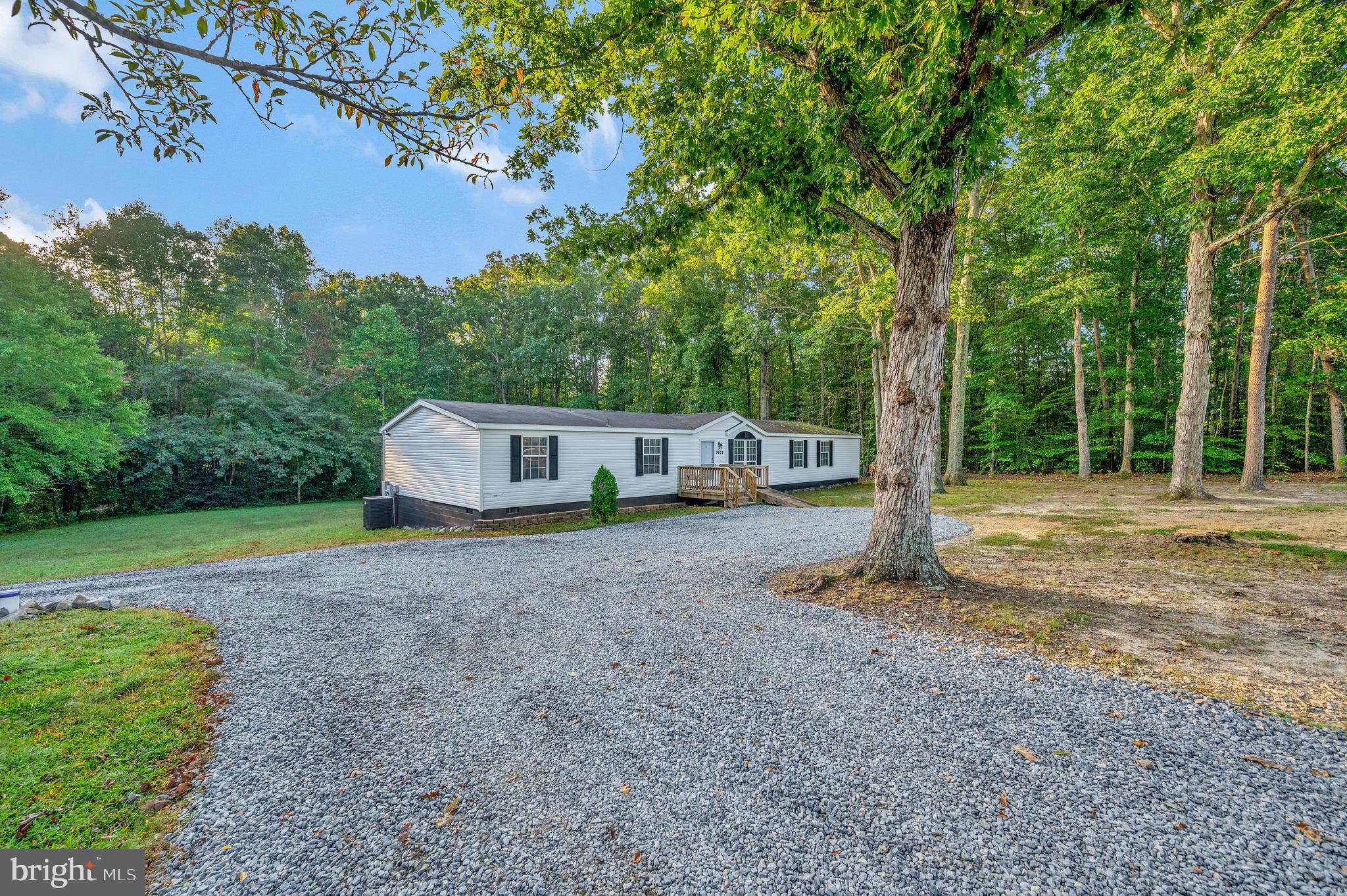 9863 Red Hill Road Spotsylvania, VA 22553 - Photo 3 of 53 a view of a house with backyard and a tree