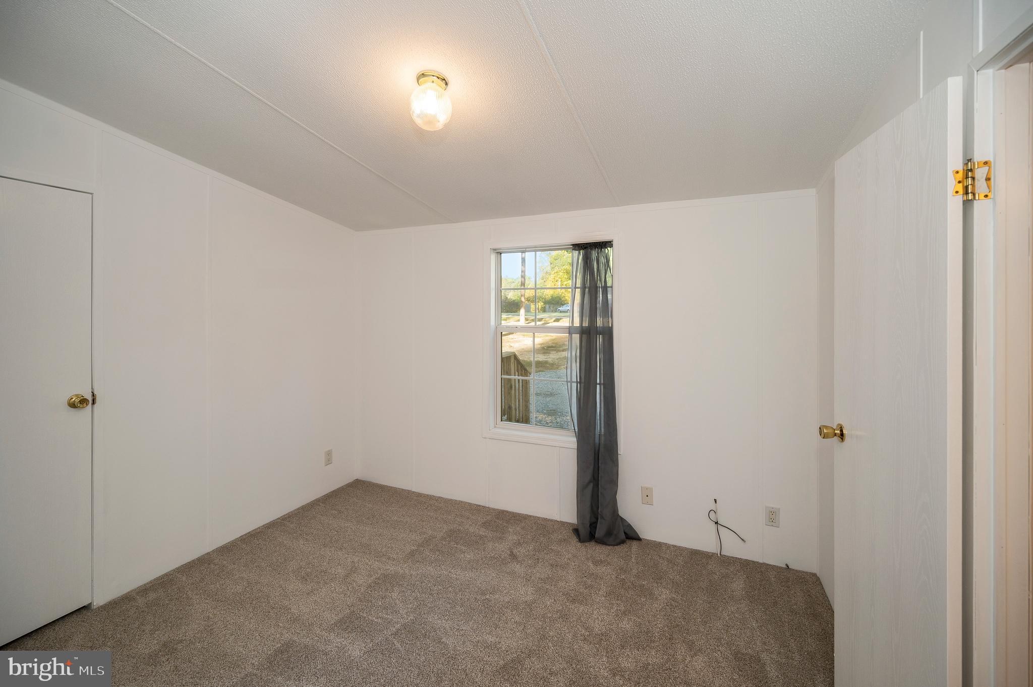 9863 Red Hill Road Spotsylvania, VA 22553 - Photo 35 of 53 an empty room with windows