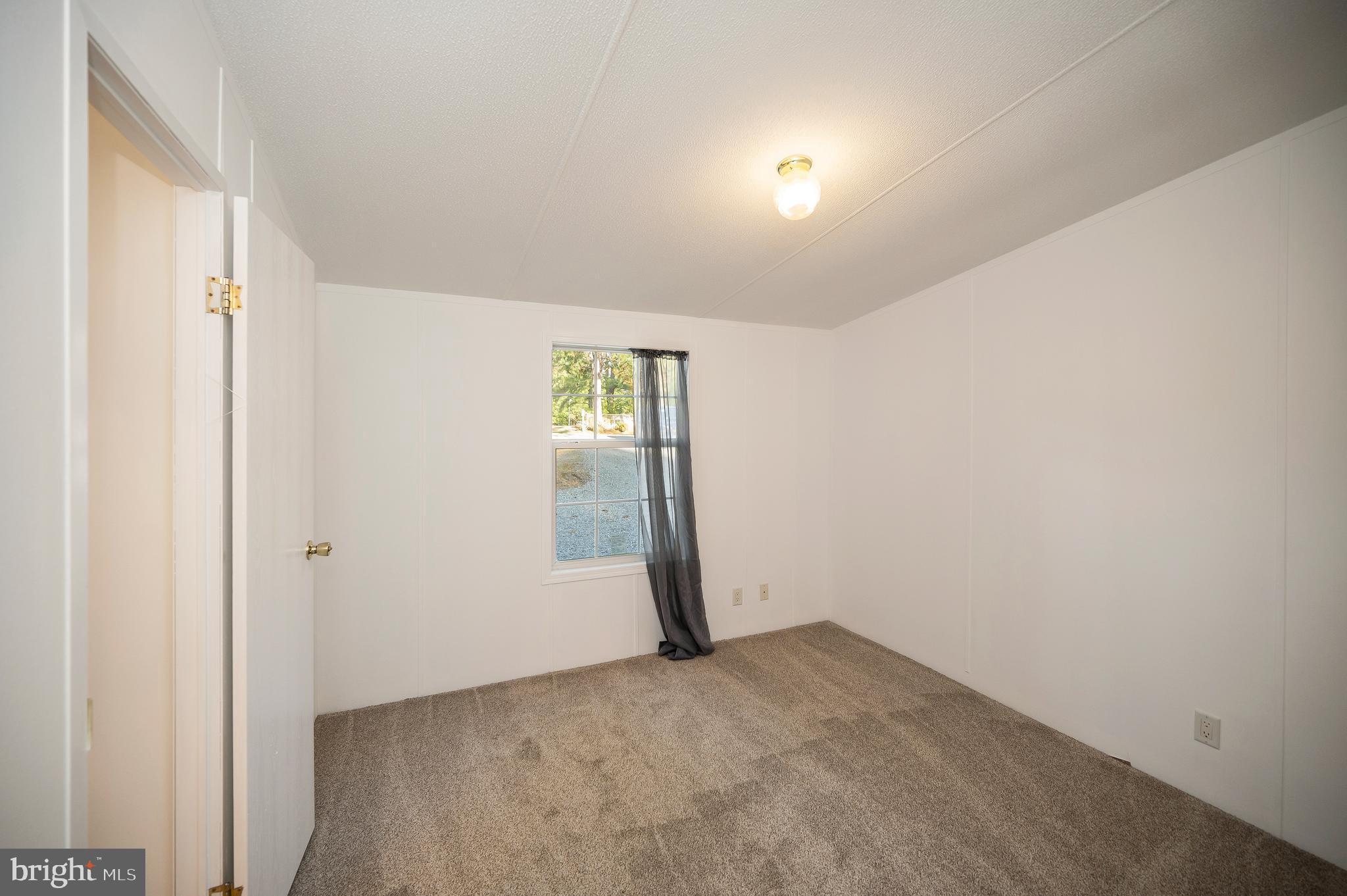 9863 Red Hill Road Spotsylvania, VA 22553 - Photo 38 of 53 an empty room with windows