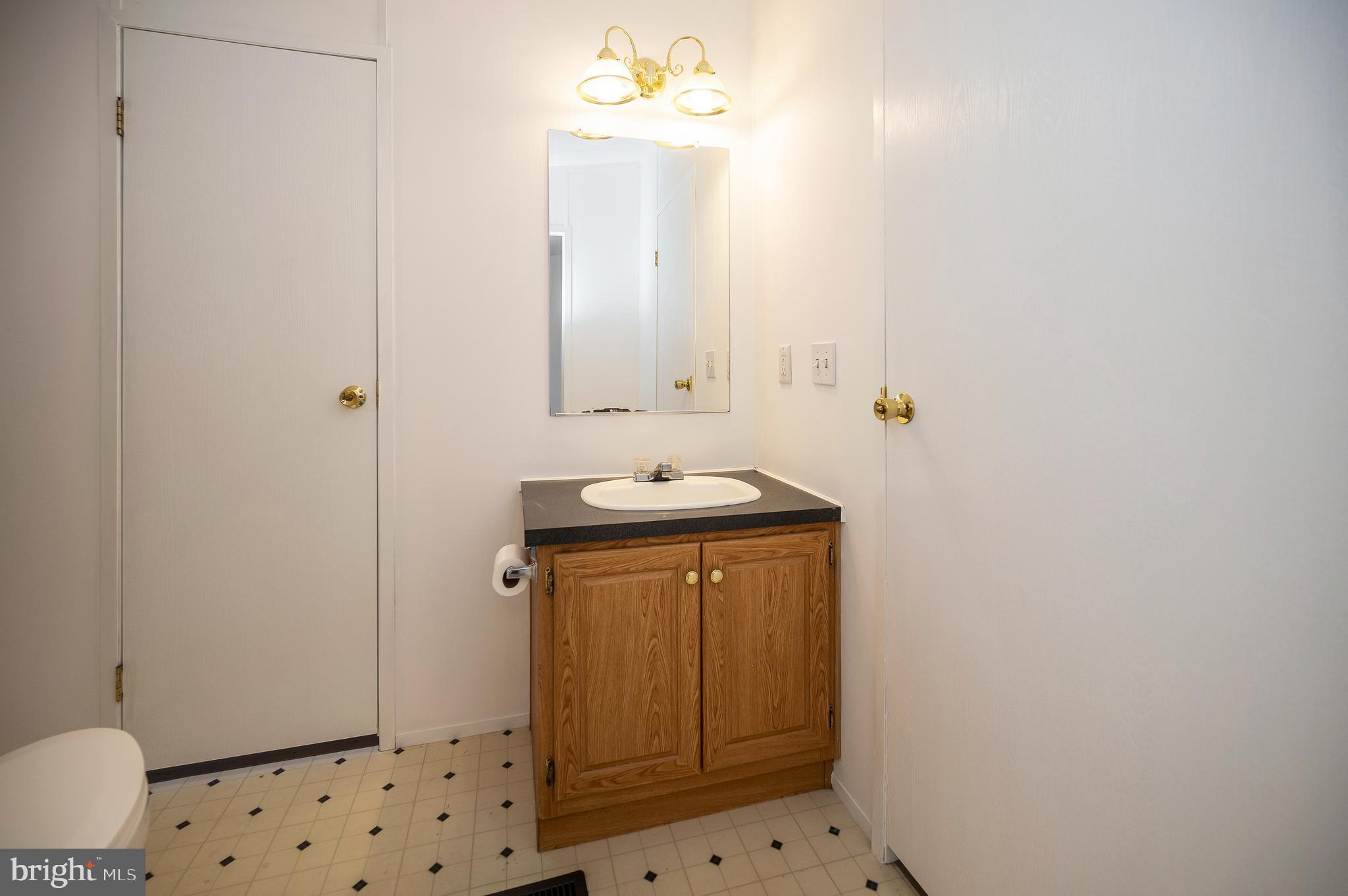 9863 Red Hill Road Spotsylvania, VA 22553 - Photo 42 of 53 a bathroom with a sink a toilet and shower