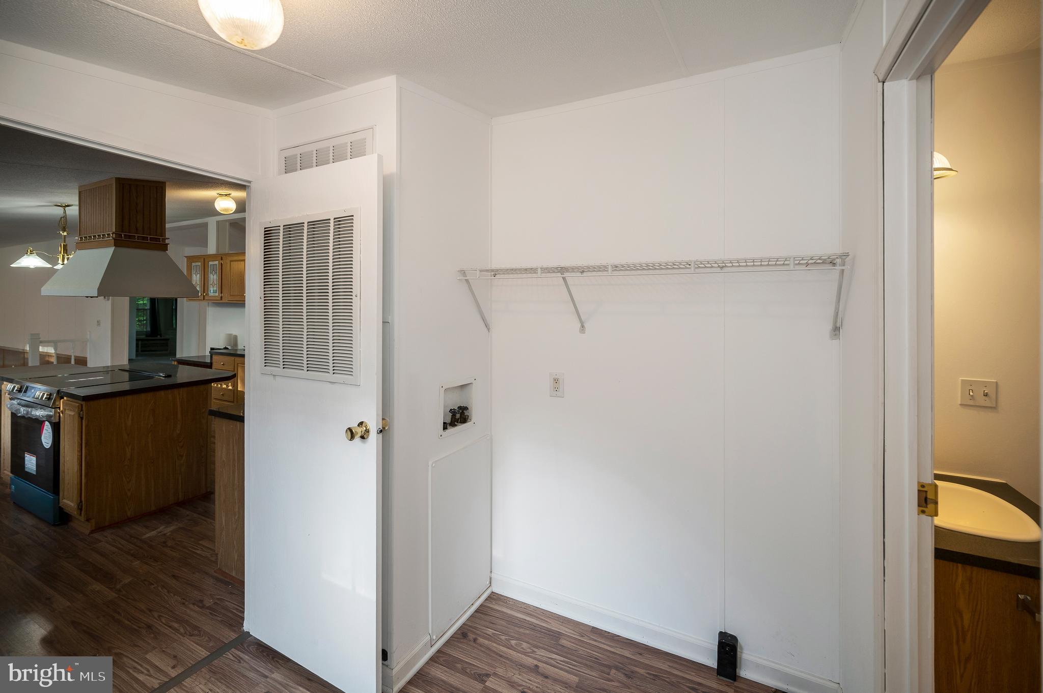 9863 Red Hill Road Spotsylvania, VA 22553 - Photo 43 of 53 a view of a kitchen from the hallway