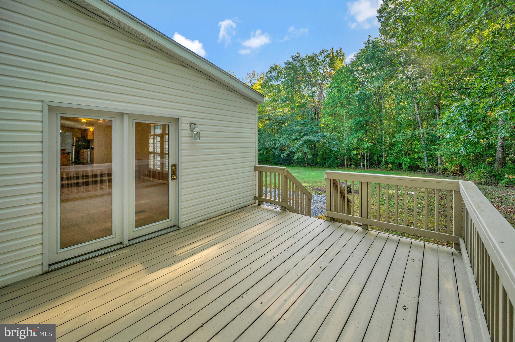 9863 Red Hill Road Spotsylvania, VA 22553 - Photo 45 of 53 a view of deck with wooden floor and fence