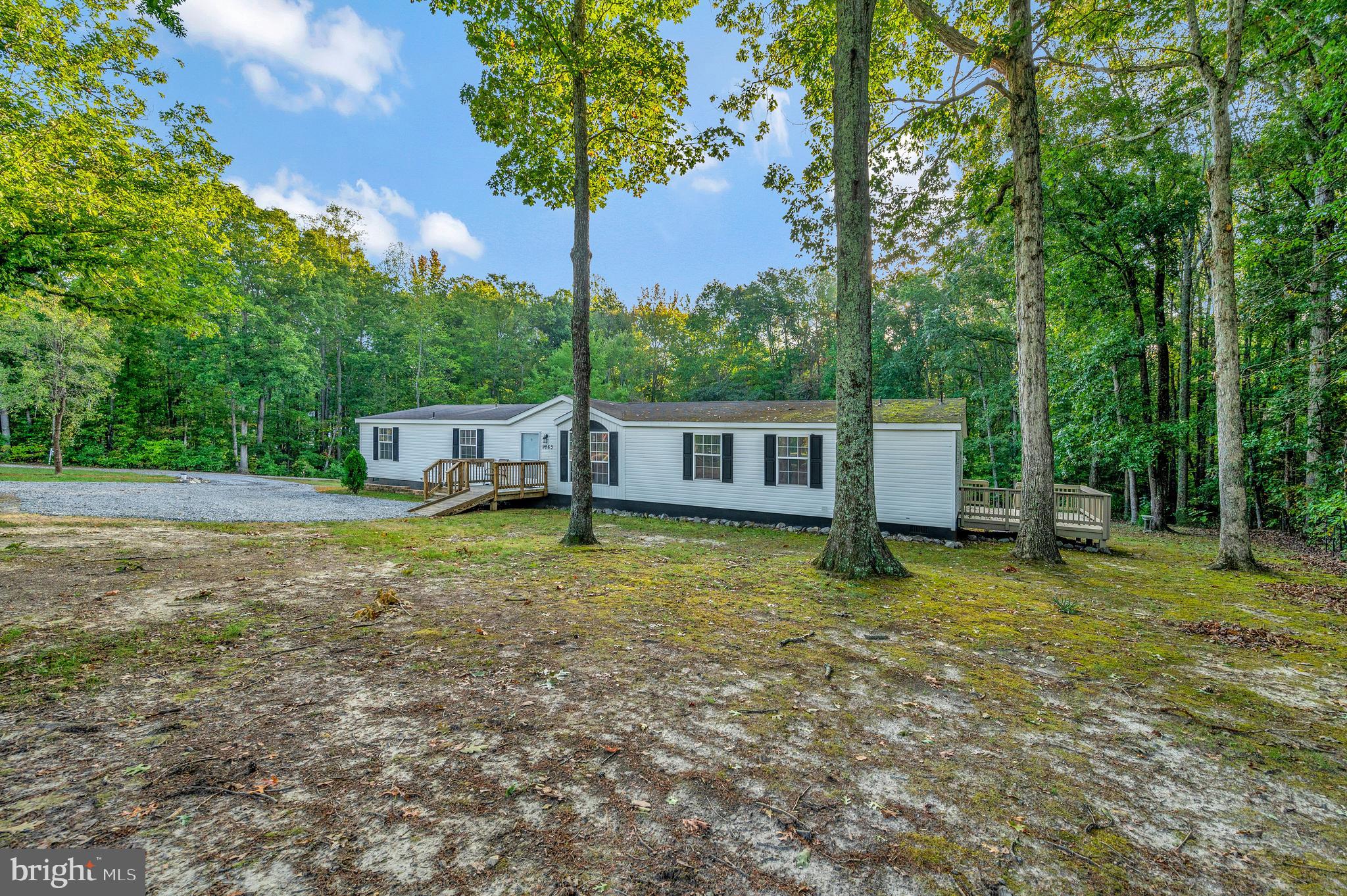 9863 Red Hill Road Spotsylvania, VA 22553 - Photo 6 of 53 a view of a house with backyard and a tree