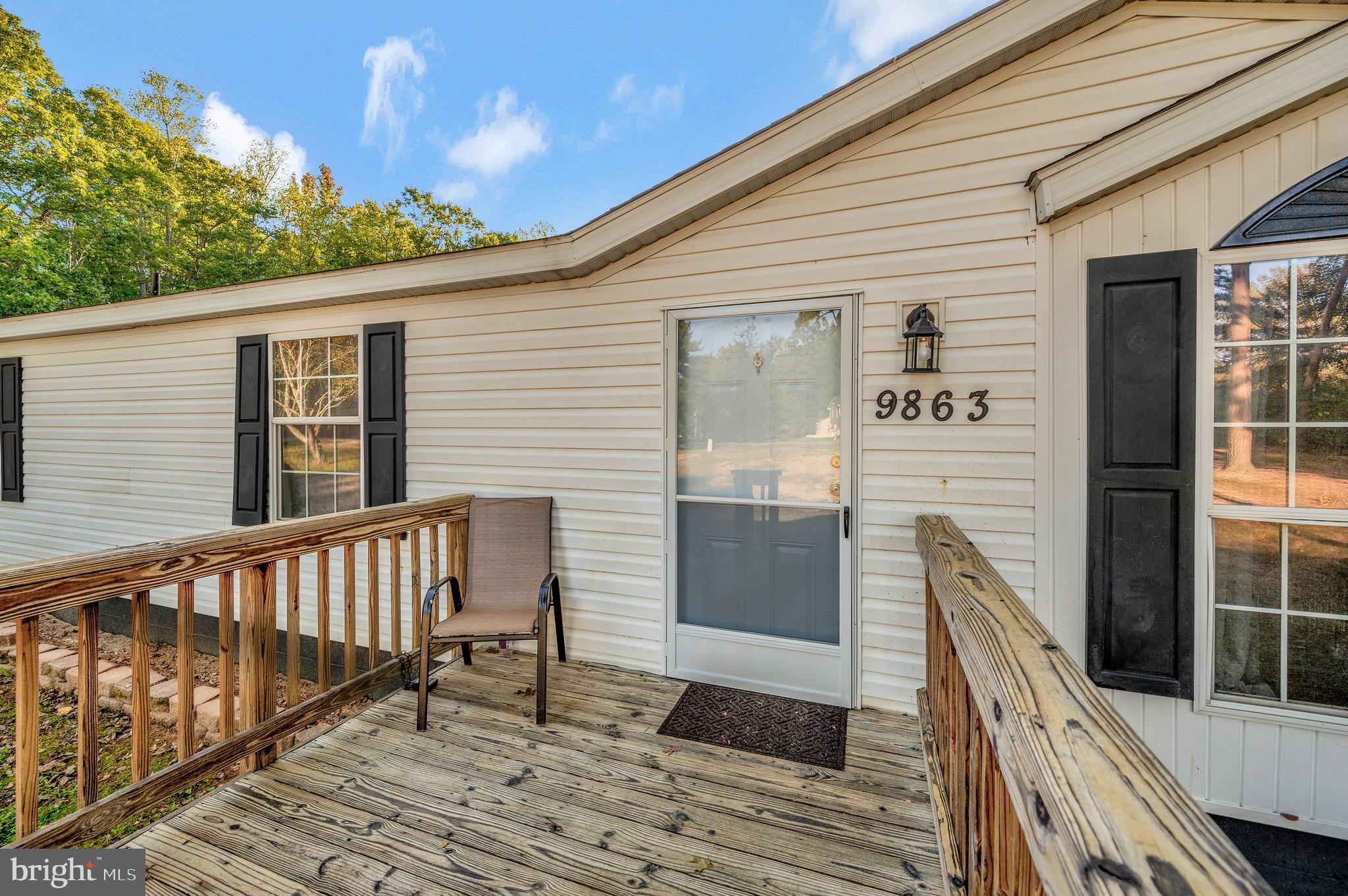 9863 Red Hill Road Spotsylvania, VA 22553 - Photo 7 of 53 a porch with seating space