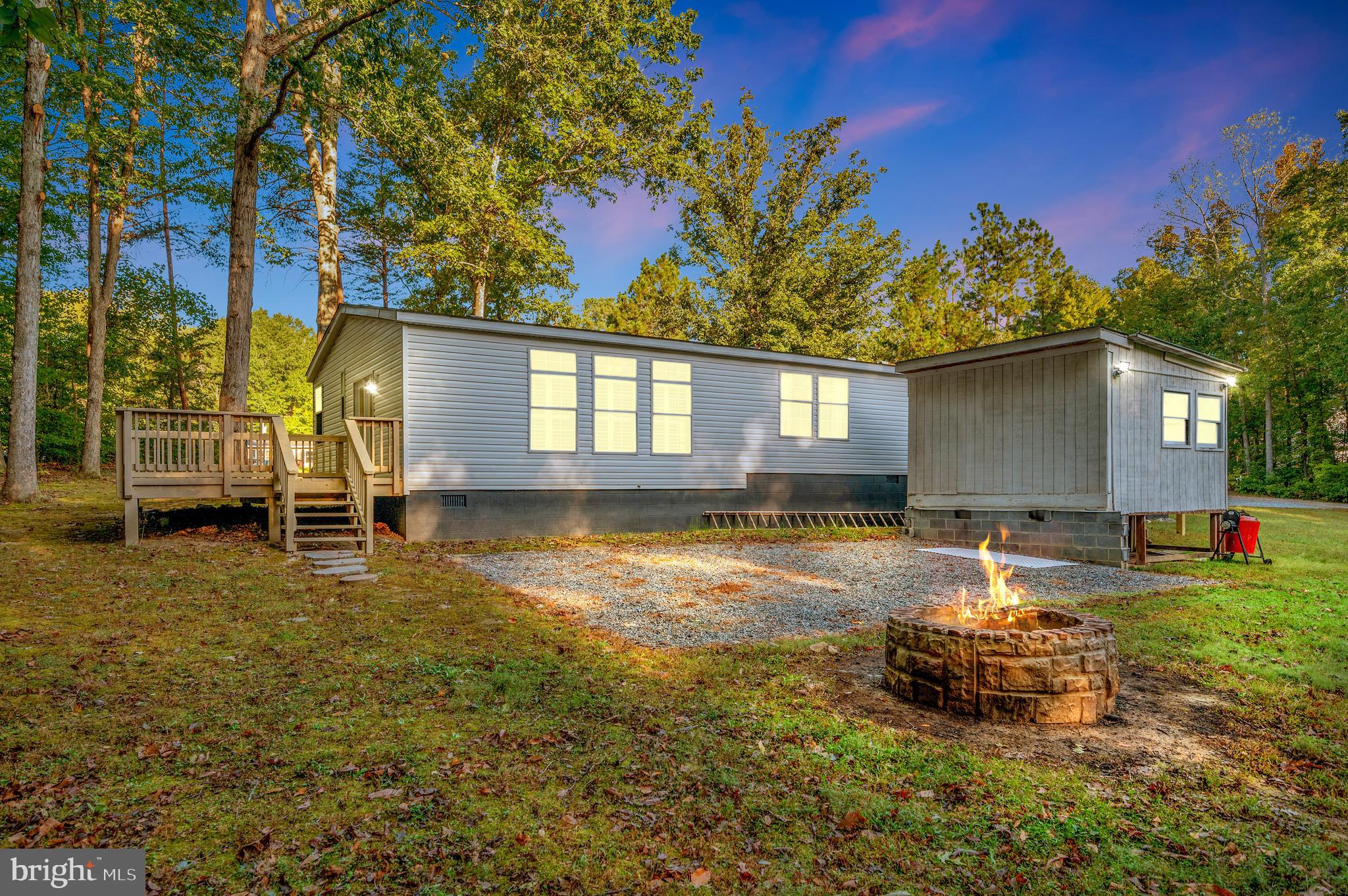 9863 Red Hill Road Spotsylvania, VA 22553 - Photo 9 of 53 a swimming pool view with a outdoor seating