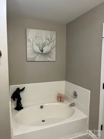 a white bath tub sitting in a bathroom