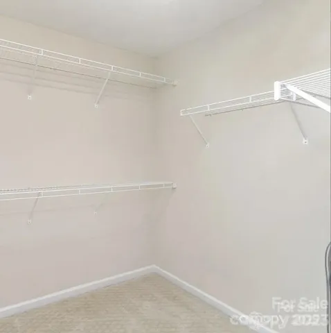 a view of a room with racks on the wall