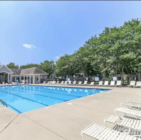 a view of a swimming pool and an outdoor space