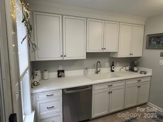 a view of a sink and cabinets
