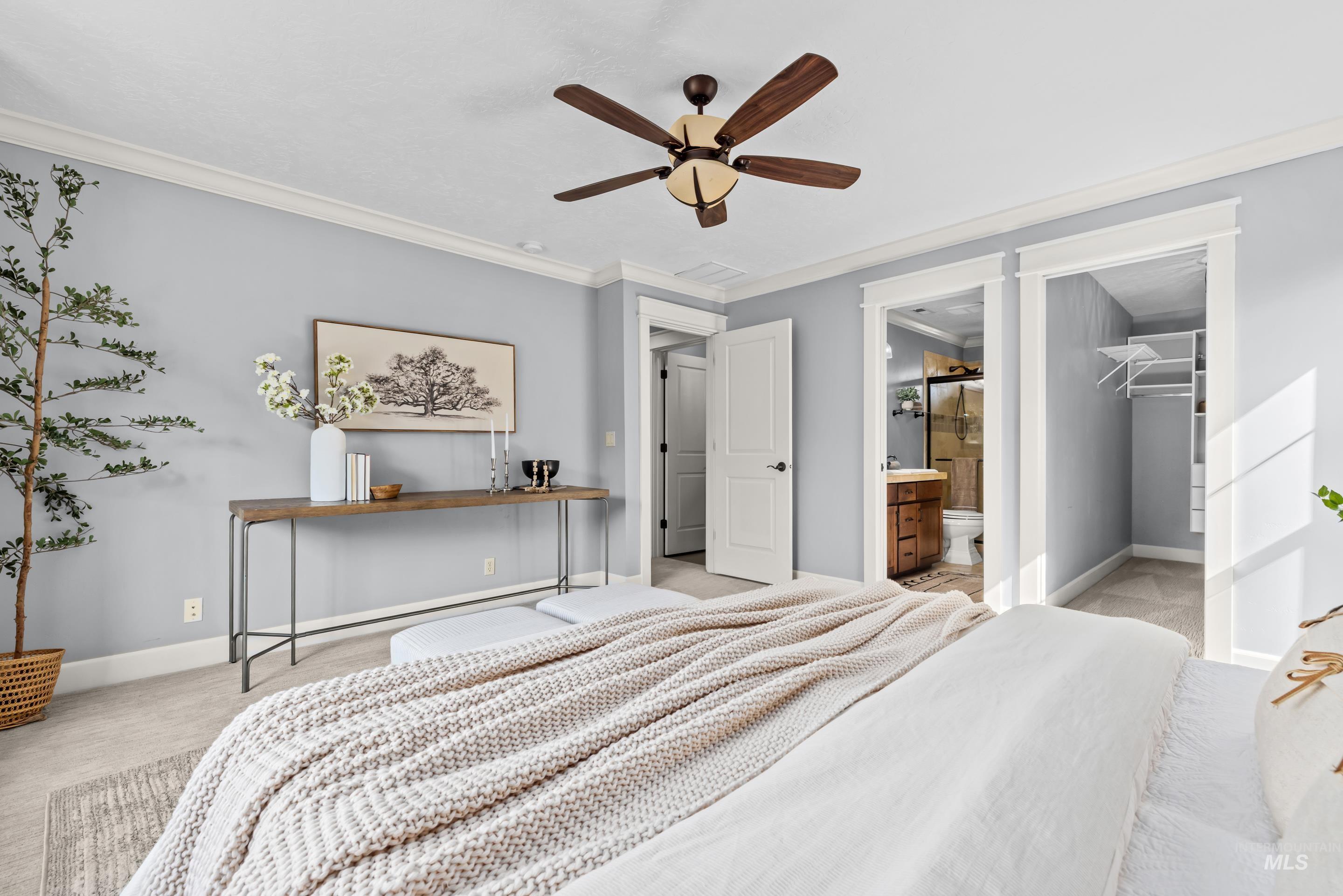 1862 West Ridenbaugh Street Boise, ID 83702 - Photo 27 of 40 Light gray wall paint, crown molding, ceiling fan, carpeted flooring, and white trim
