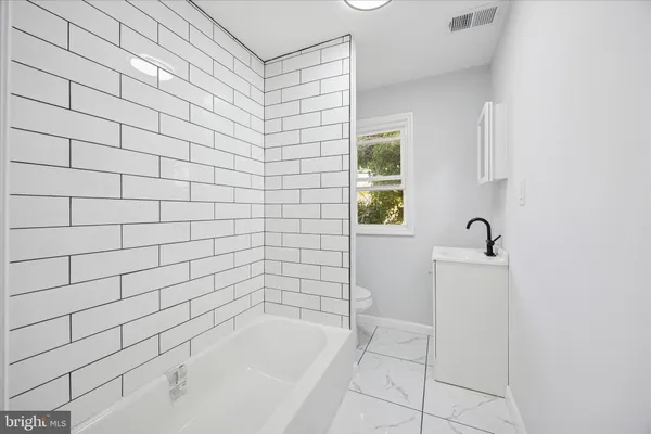 a bathroom with a bathtub