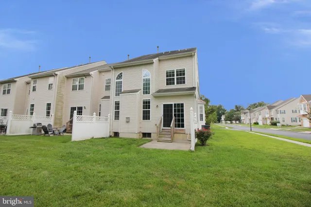 a view of house with yard
