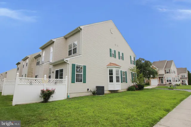 a view of house with yard