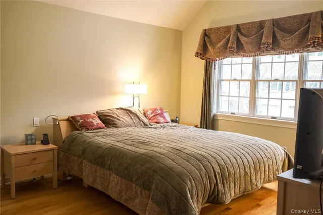 a bedroom with a bed and window