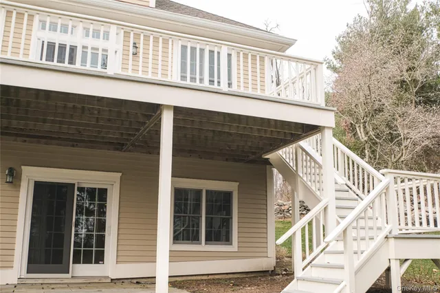 a view of a house with wooden fence