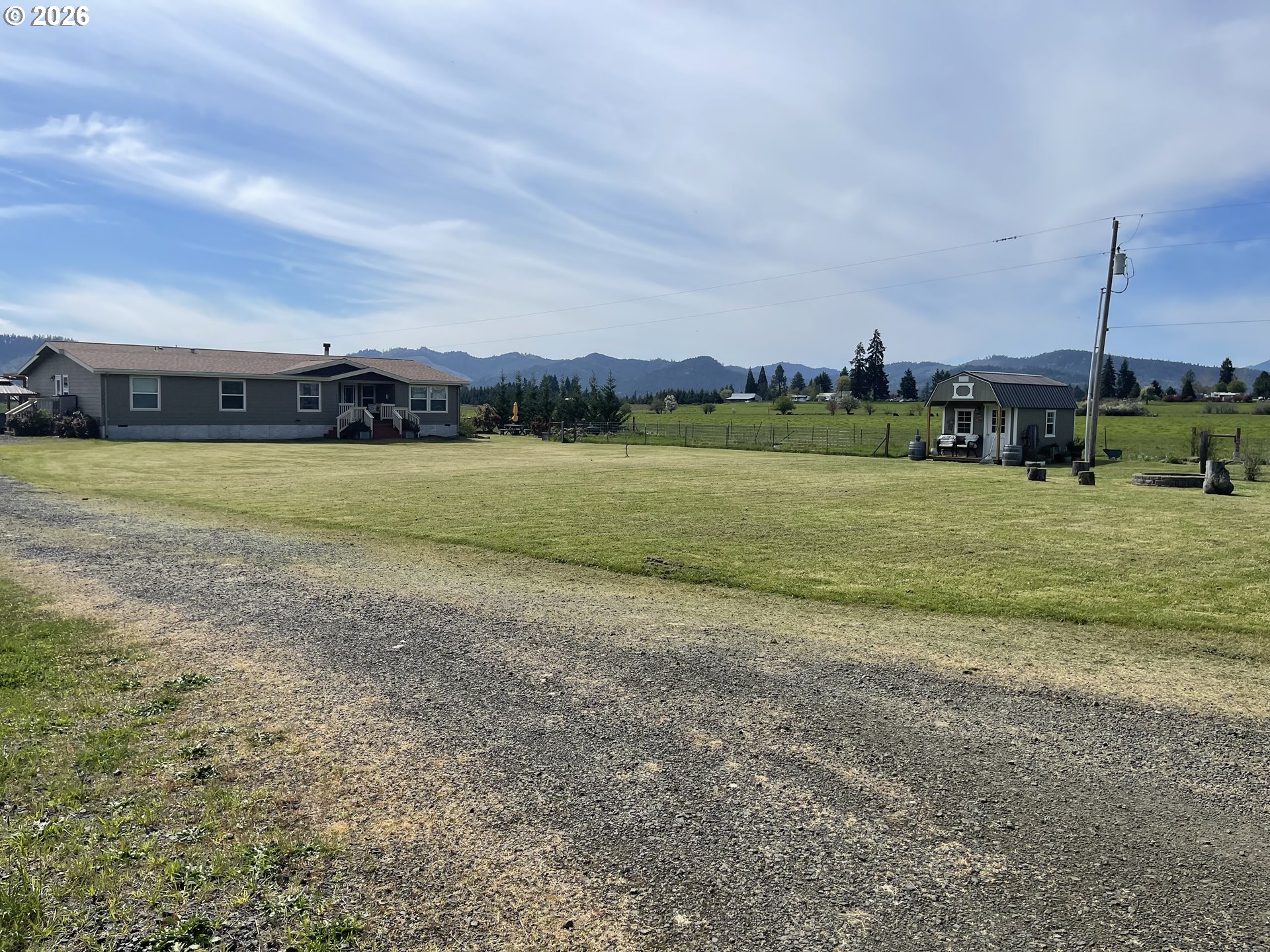 6404 Lookingglass Road Roseburg, OR 97471 - Photo 4 of 48 a view of a field with an ocean