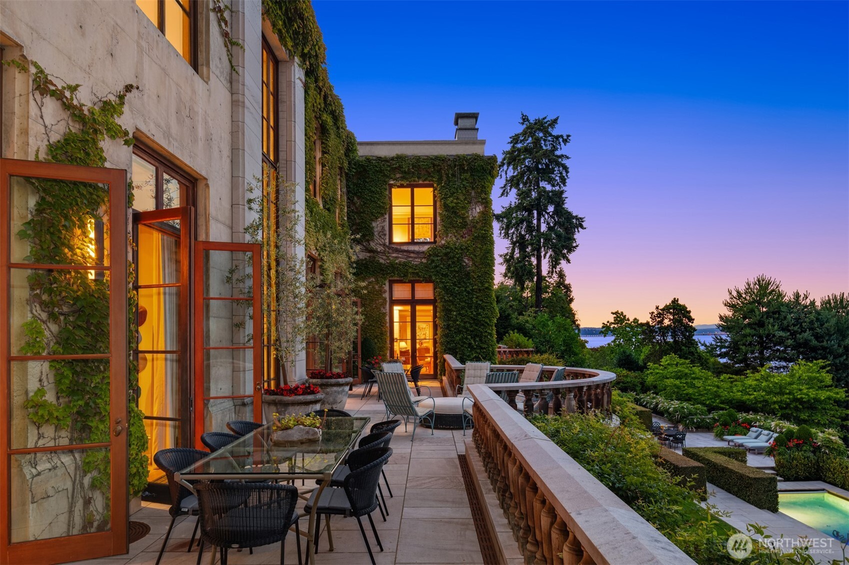 Undisclosed Address Seattle, WA 98112 - Photo 10 of 15 a balcony filled with a potted plant and outdoor seating