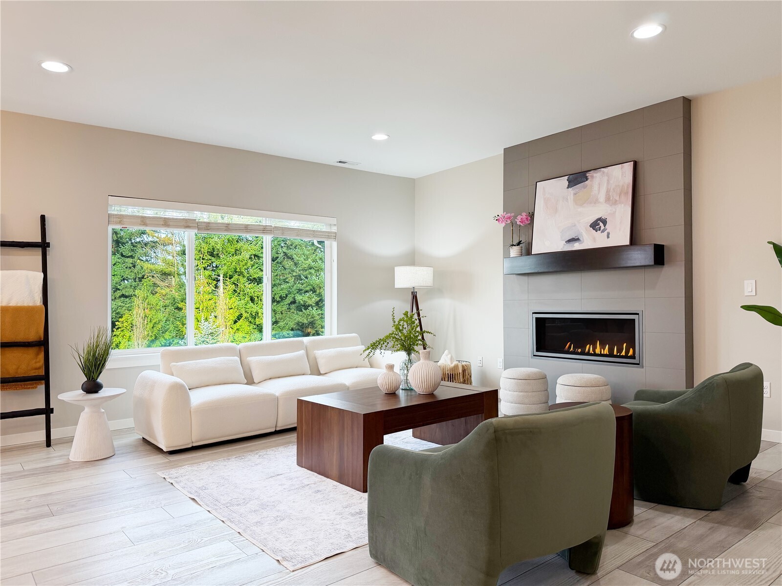 22724 41st Drive Southeast Bothell, WA 98021 - Photo 6 of 40 a living room with furniture two windows and a fireplace