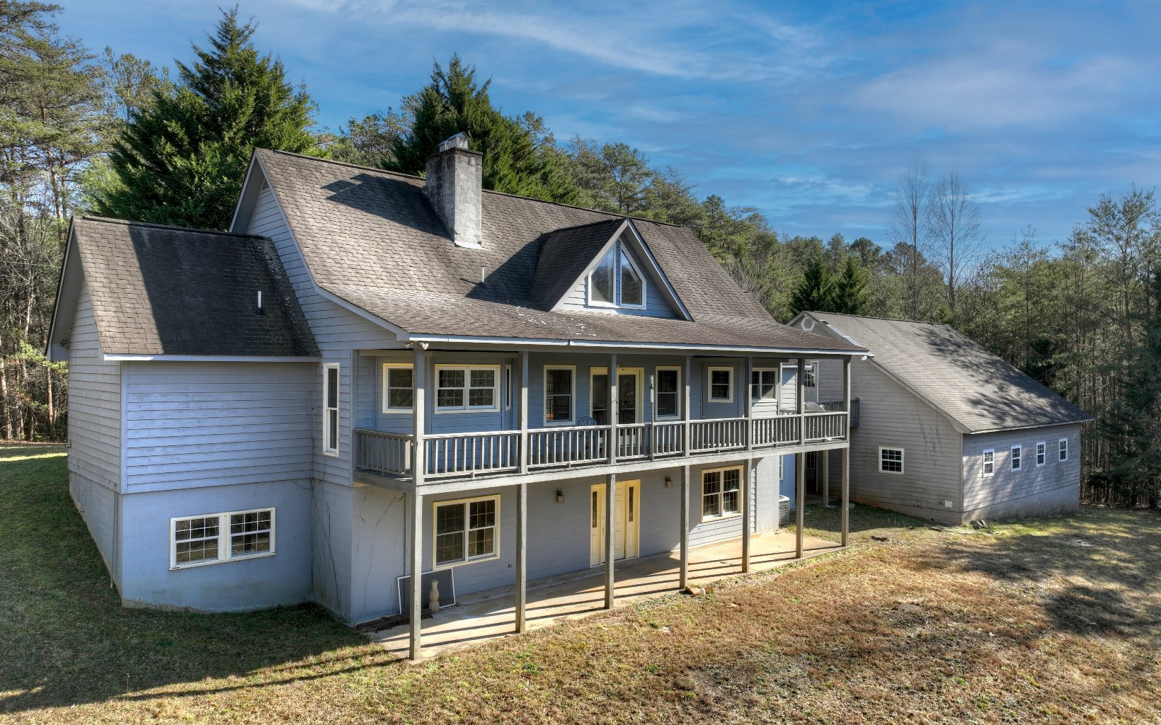 206 Cedar Valley Road Blue Ridge, GA 30513 - Photo 49 of 75 a front view of a house with a garden