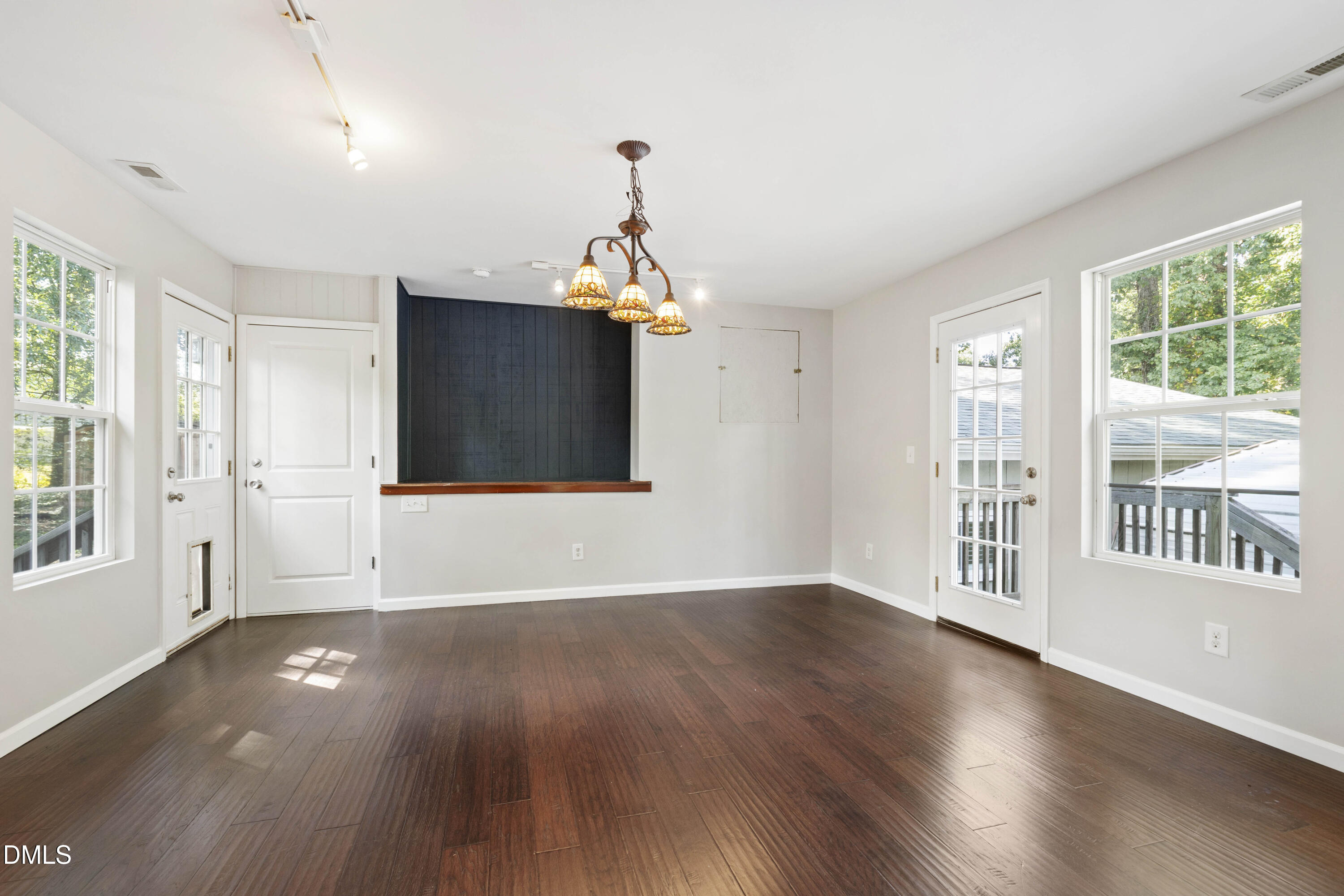 2415 Dorety Place Raleigh, NC 27604 - Photo 24 of 53 a view of an empty room with wooden floor and a window