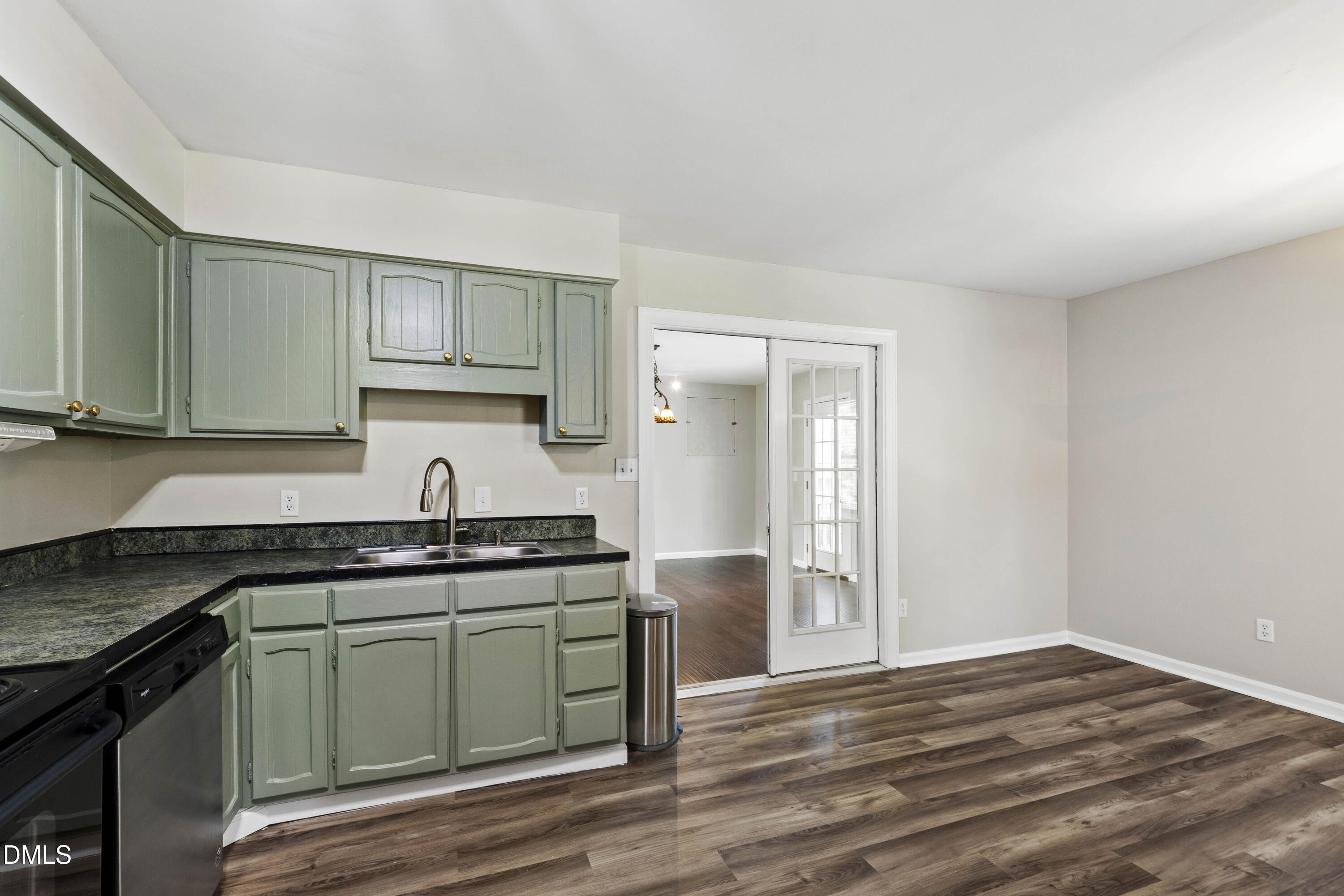 2415 Dorety Place Raleigh, NC 27604 - Photo 31 of 53 a kitchen with granite countertop a sink and cabinets