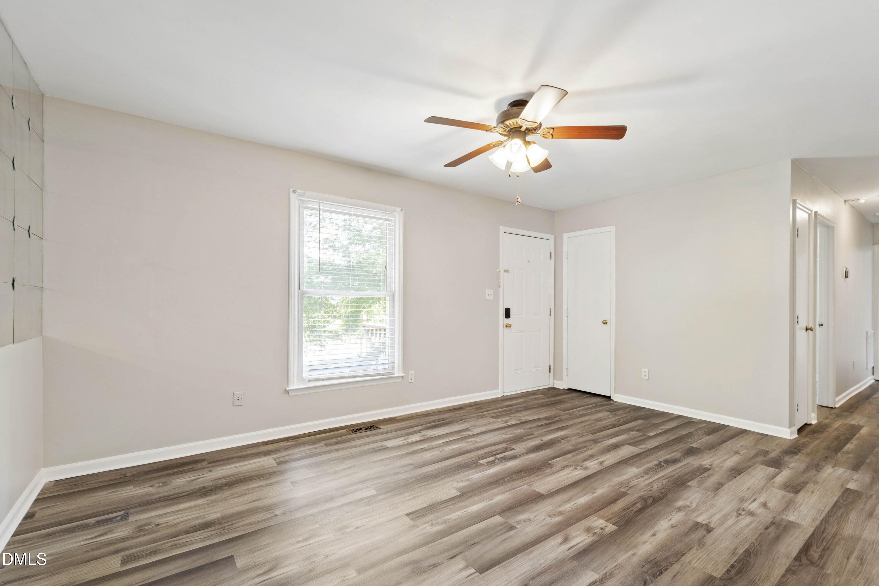 2415 Dorety Place Raleigh, NC 27604 - Photo 36 of 53 a view of an empty room with window and wooden floor