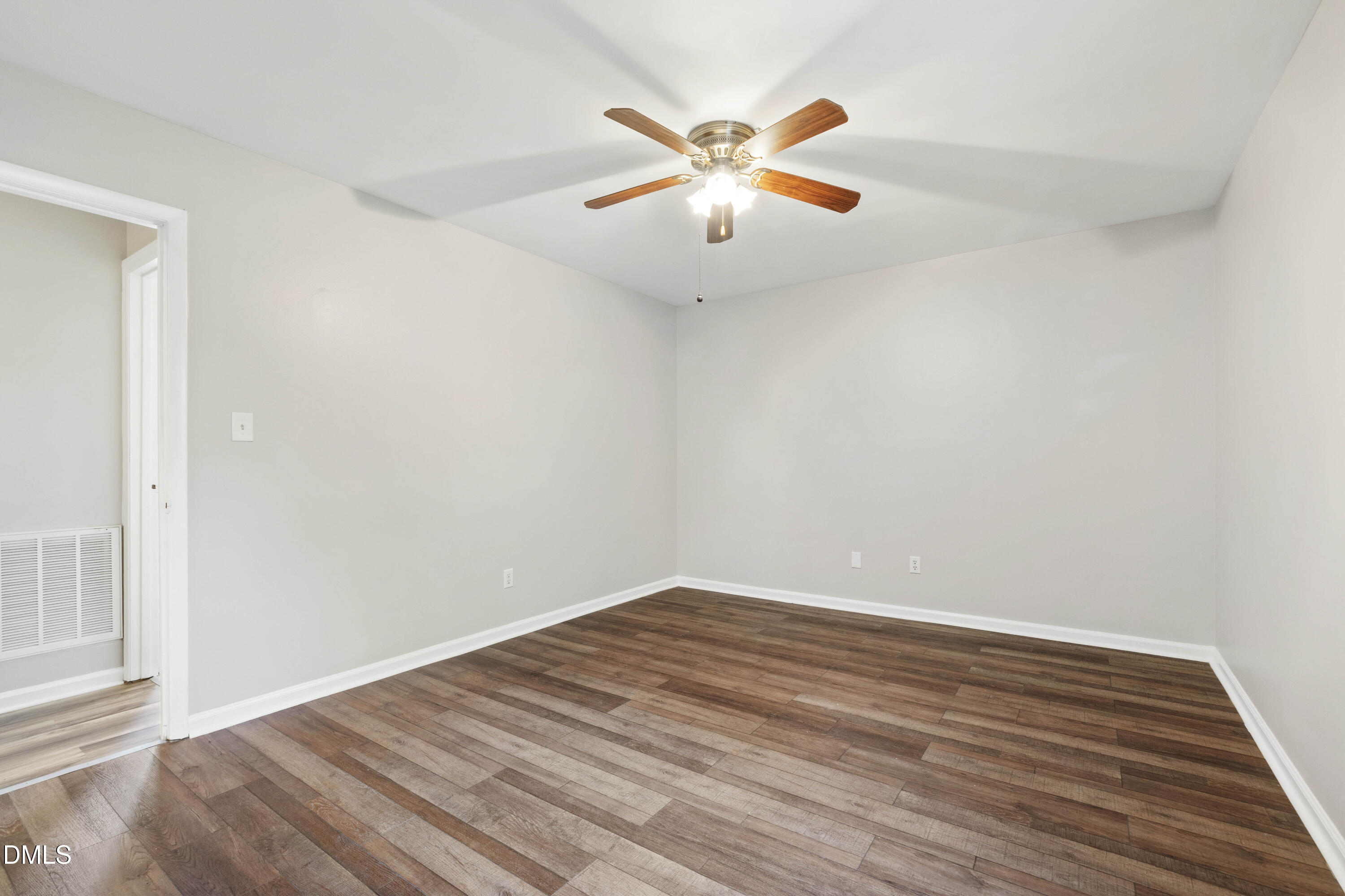 2415 Dorety Place Raleigh, NC 27604 - Photo 38 of 53 an empty room with wooden floor and fan