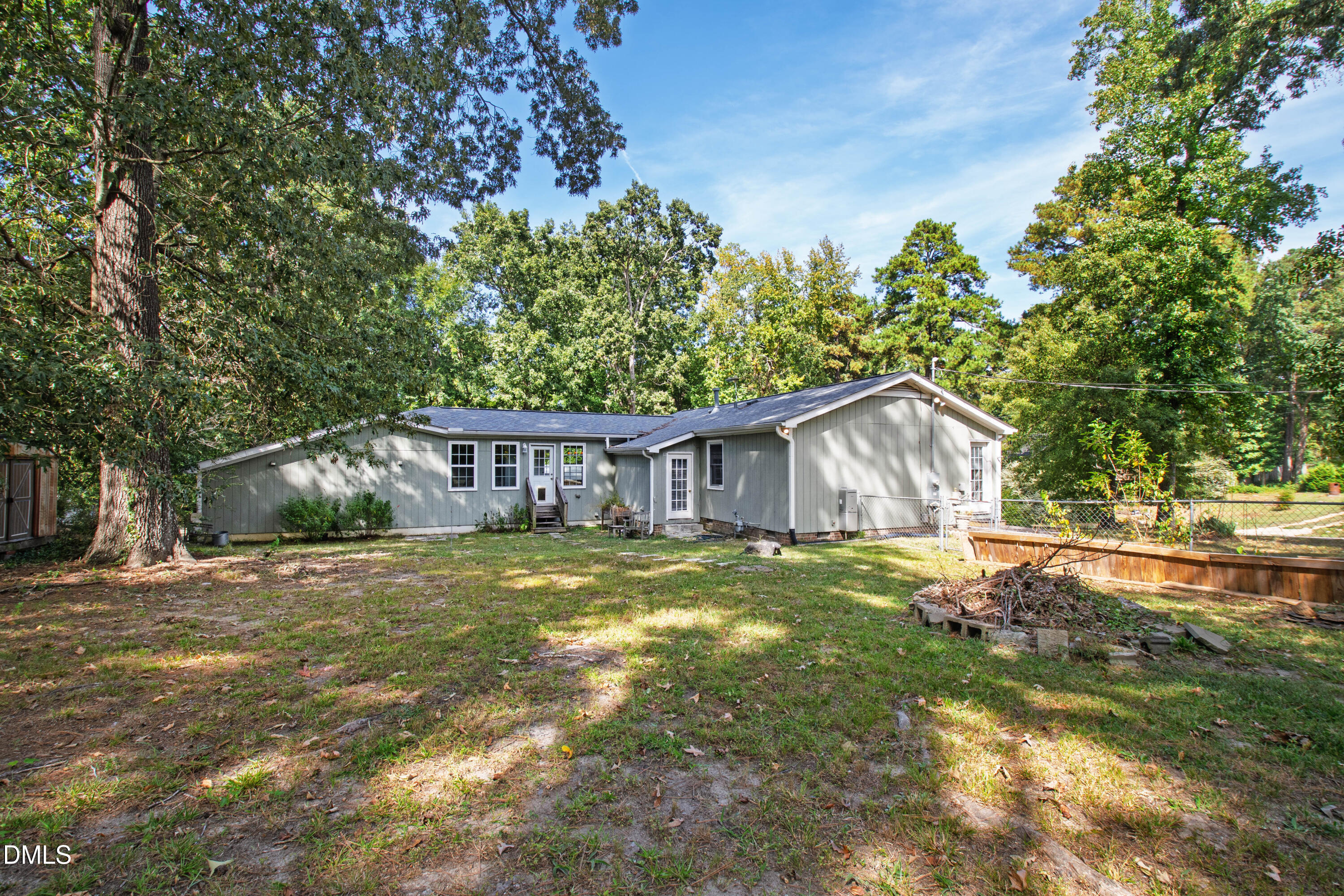2415 Dorety Place Raleigh, NC 27604 - Photo 48 of 53 a view of a big house with a big yard plants and large trees