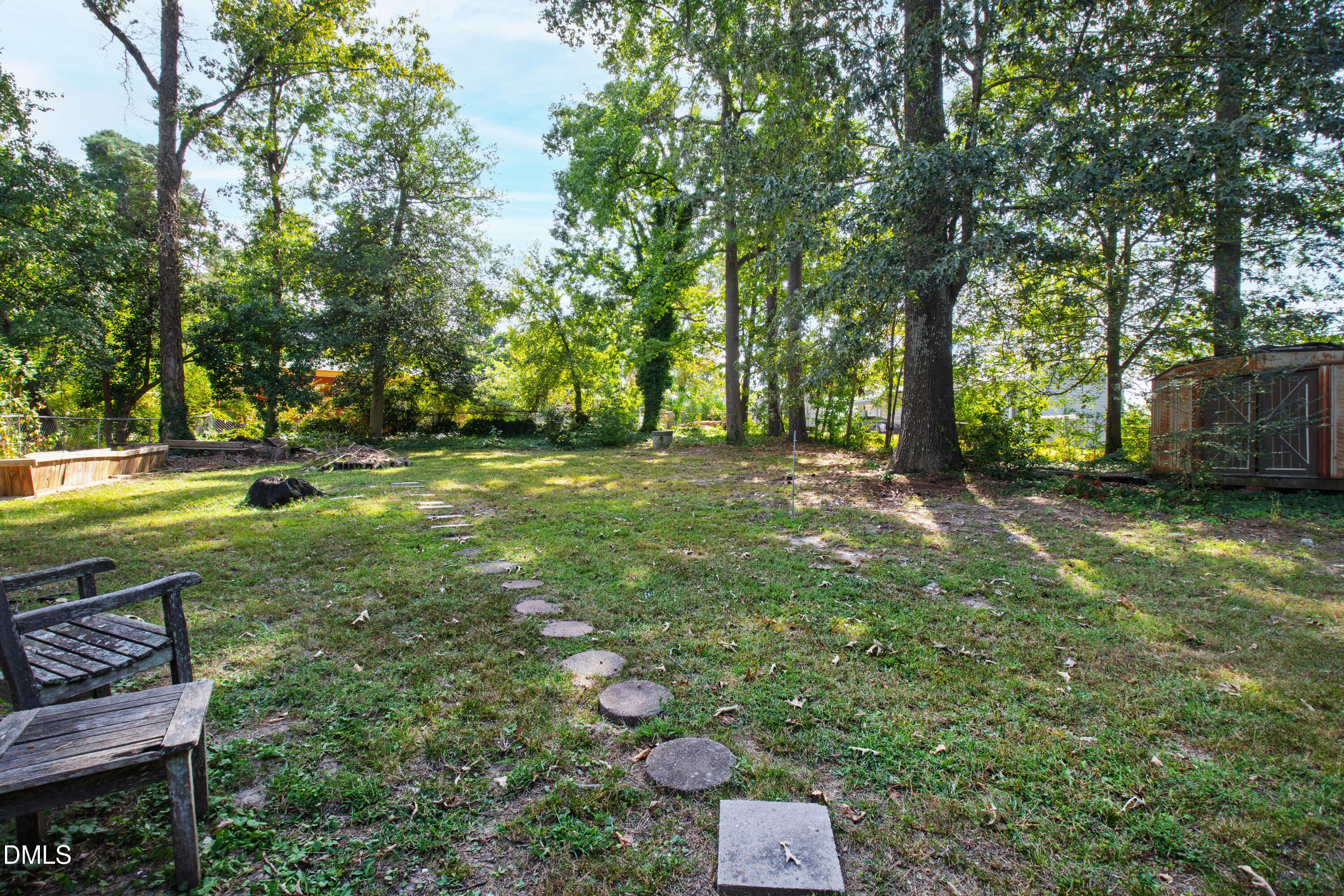 2415 Dorety Place Raleigh, NC 27604 - Photo 50 of 53 a backyard of a house with lots of green space