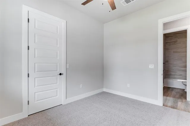 an empty room with closet area