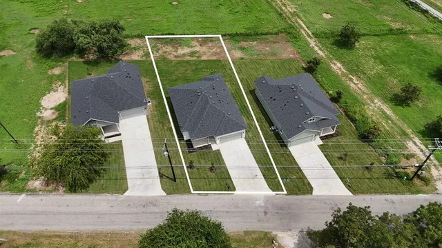 an aerial view of house with yard