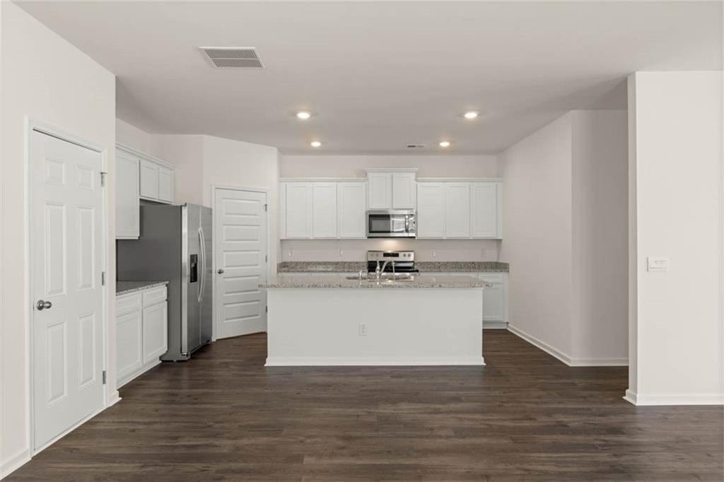 6010 Knickerbocker Street Mableton, GA 30126 - Photo 2 of 12 a view of kitchen with wooden floor