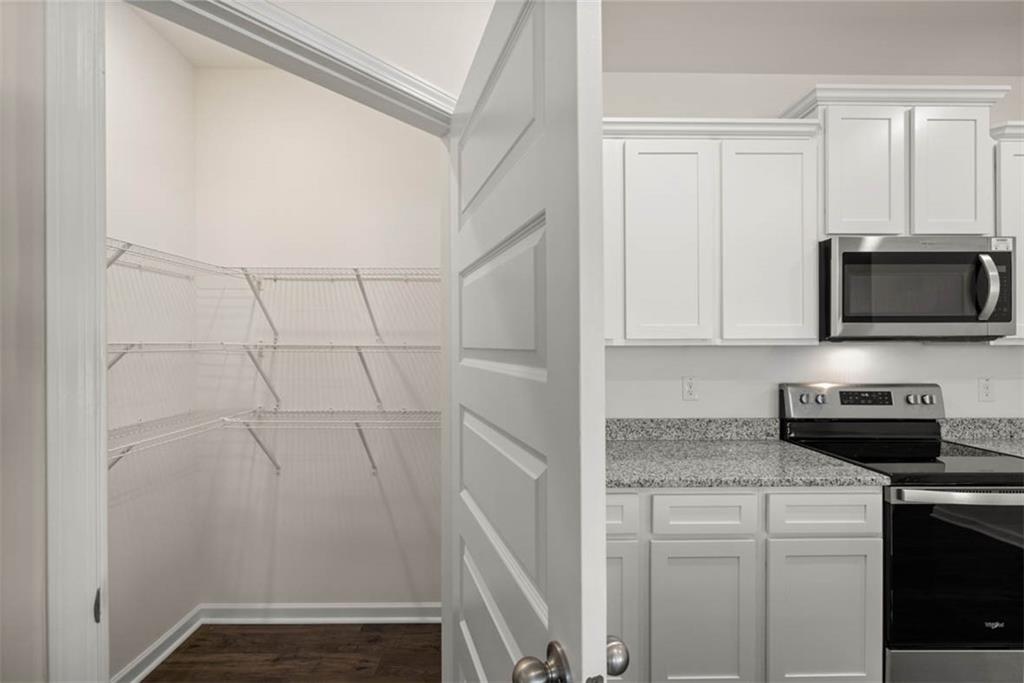 6010 Knickerbocker Street Mableton, GA 30126 - Photo 5 of 12 a kitchen with a sink and cabinets