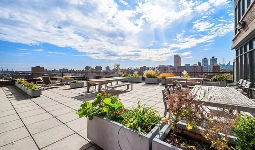 1485 5th Avenue, Unit 13A Manhattan, NY 10035 - Photo 11 of 16 a view of a terrace with lawn chairs