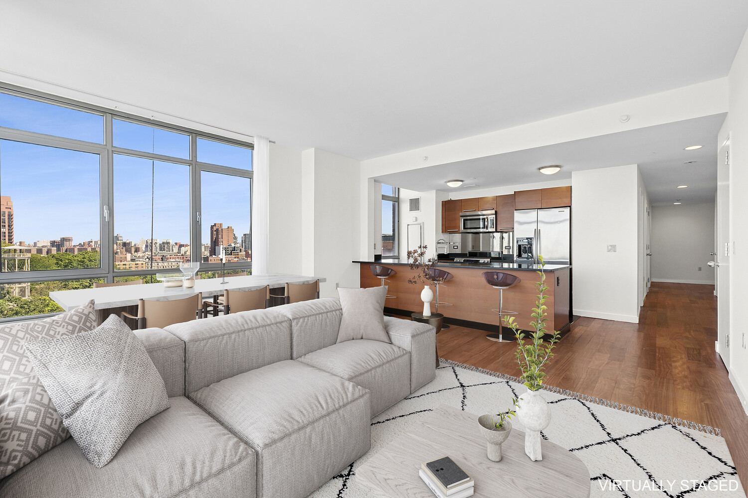 1485 5th Avenue, Unit 13A Manhattan, NY 10035 - Photo 2 of 16 a living room with furniture and a large window