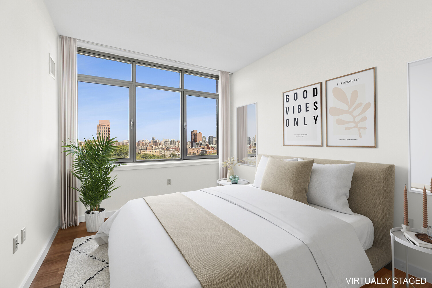 1485 5th Avenue, Unit 13A Manhattan, NY 10035 - Photo 6 of 16 a bedroom with a large bed and a potted plant