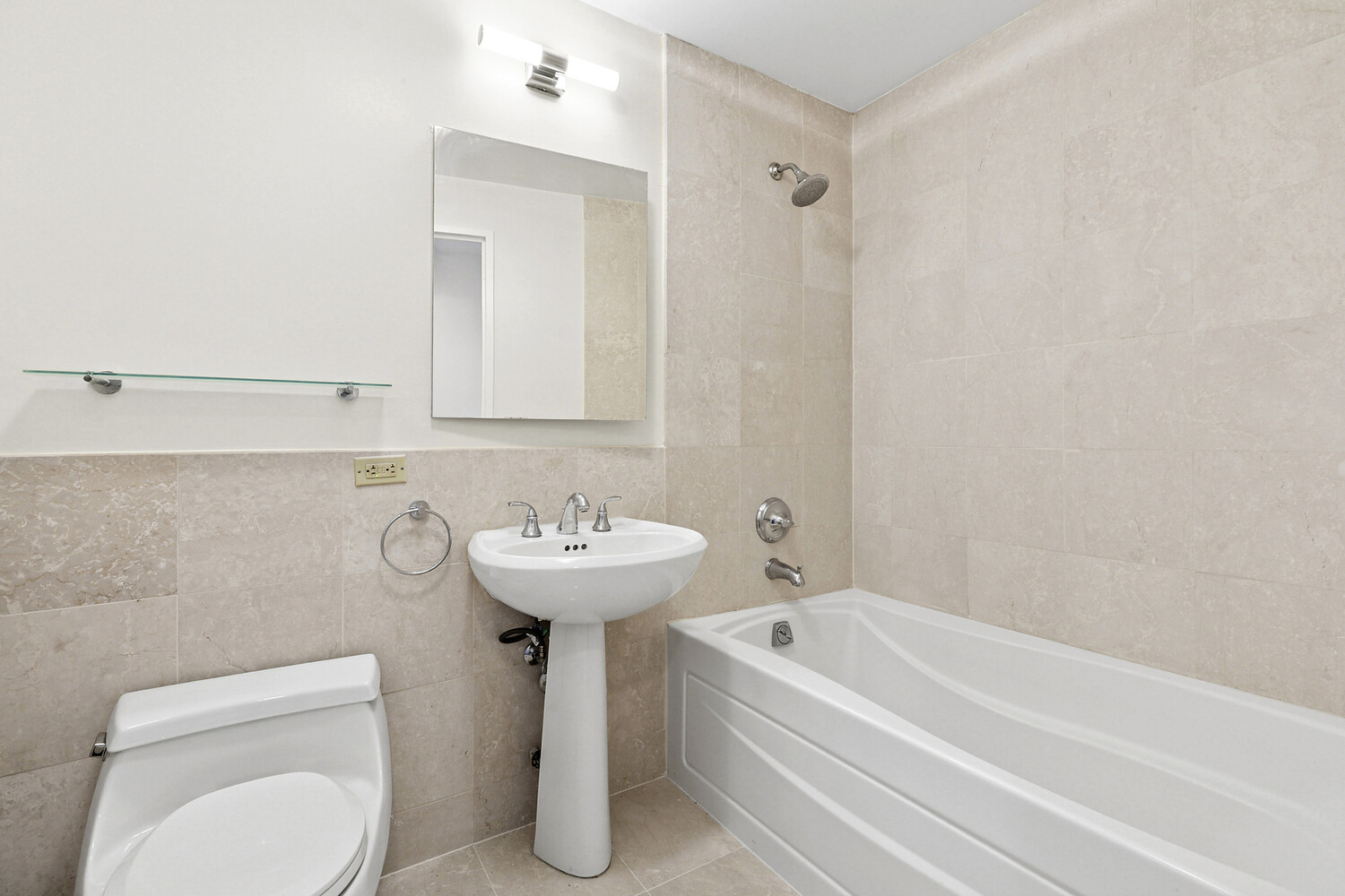 1485 5th Avenue, Unit 13A Manhattan, NY 10035 - Photo 7 of 16 a bathroom with a sink a toilet and bathtub