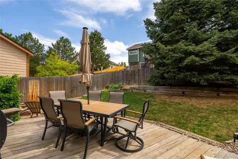 a view of a chairs with a table in the patio