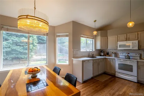 a kitchen with stainless steel appliances granite countertop a stove and a sink