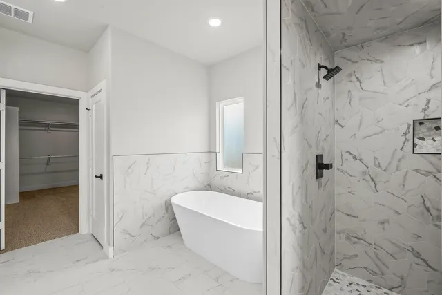 a bathroom with a toilet and shower