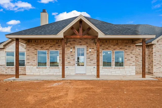 a front view of a house with a outdoor space