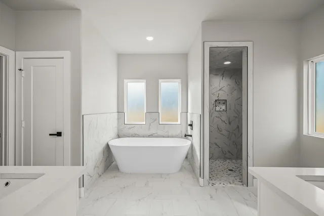 a bathroom with a bathtub a shower a sink and a bathtub